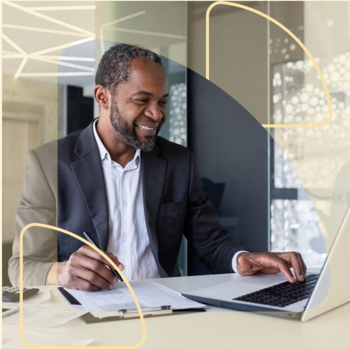 Successful satisfied leader behind paperwork inside office smiling.